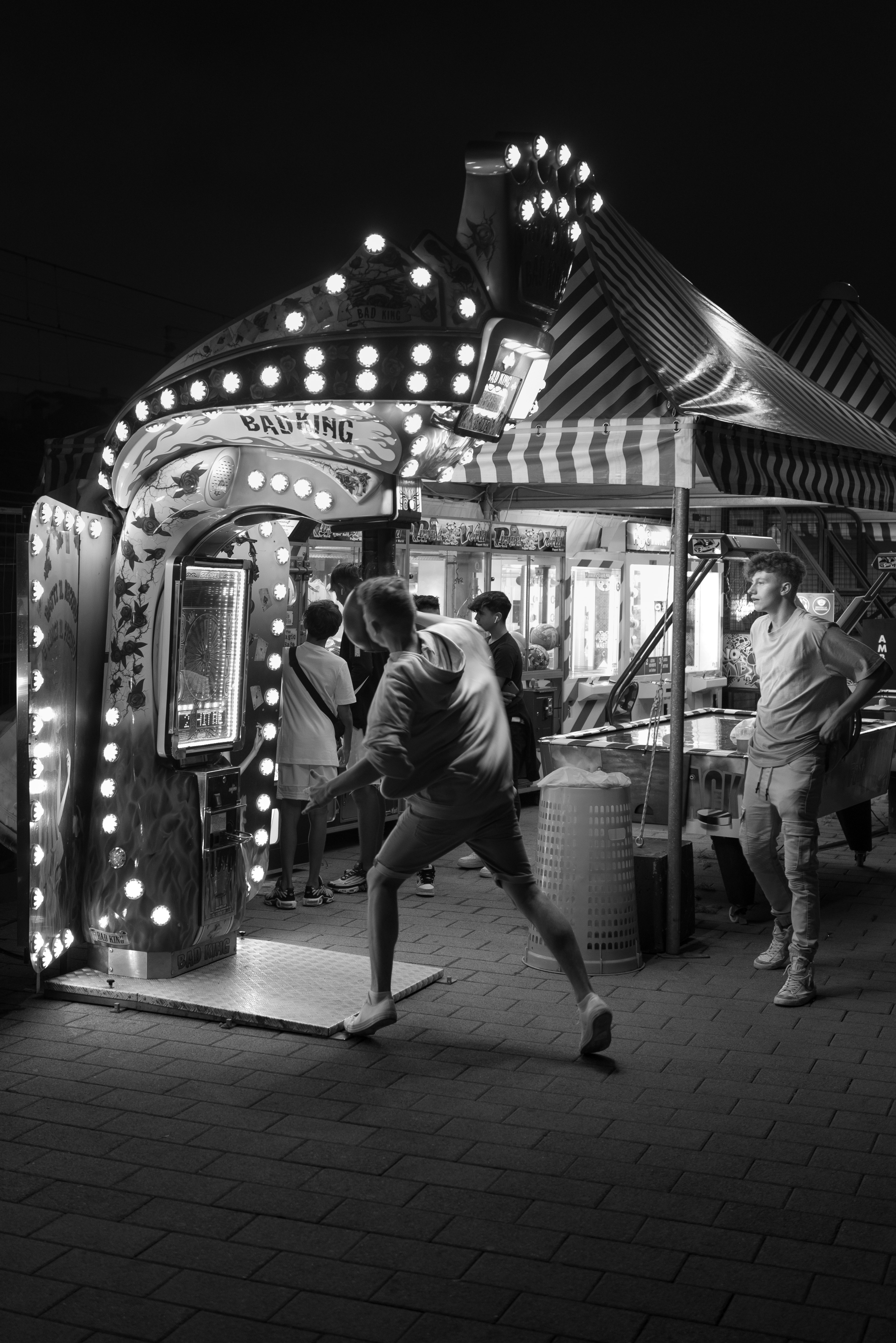 grayscale photo of people walking on street